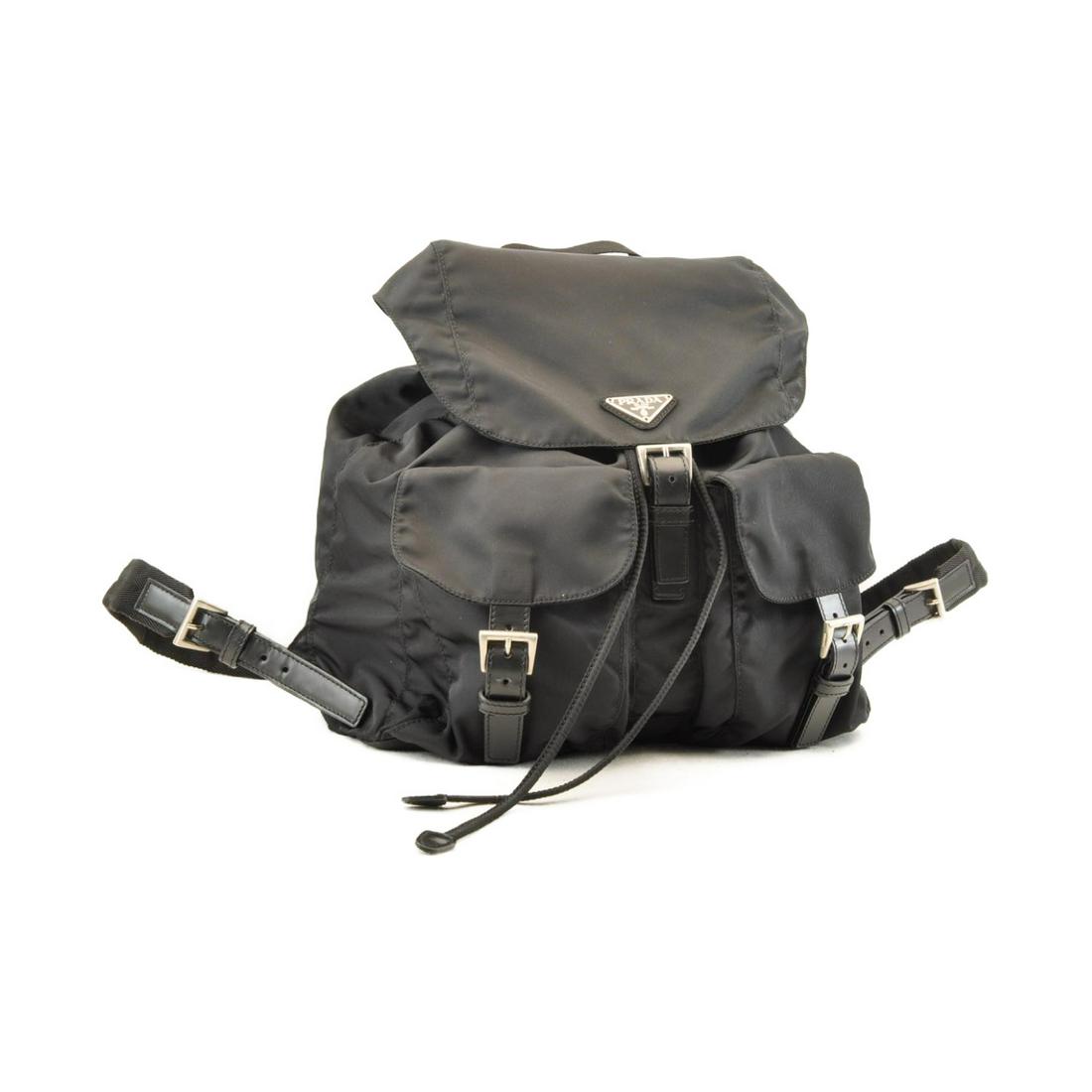 Authentic PRADA Nylon Backpack / Knapsack: Brand: PRADA Material: Nylon Style: Backpack / Knapsack Color: Black Size(inch): W12.2 x H11.02 x D6.29inch(Approx) Country of Origin: Italy Accessory: Guarantee Card / Tag Card All Bidhaus items come