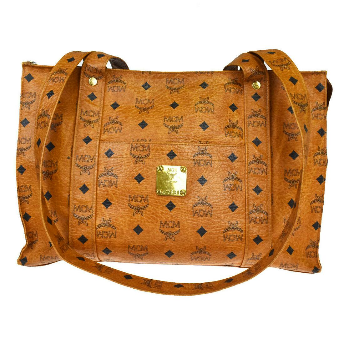 Authentic MCM Leather Shoulder Bag: Brand: MCM Material: Leather Style: Shoulder Bag Color: Brown Size(inch): W 15 x H 10.2 x D 5.5 "(approx.) Country of Origin: Germany Come with: - All Bidhaus items come with a 100% money-back authent