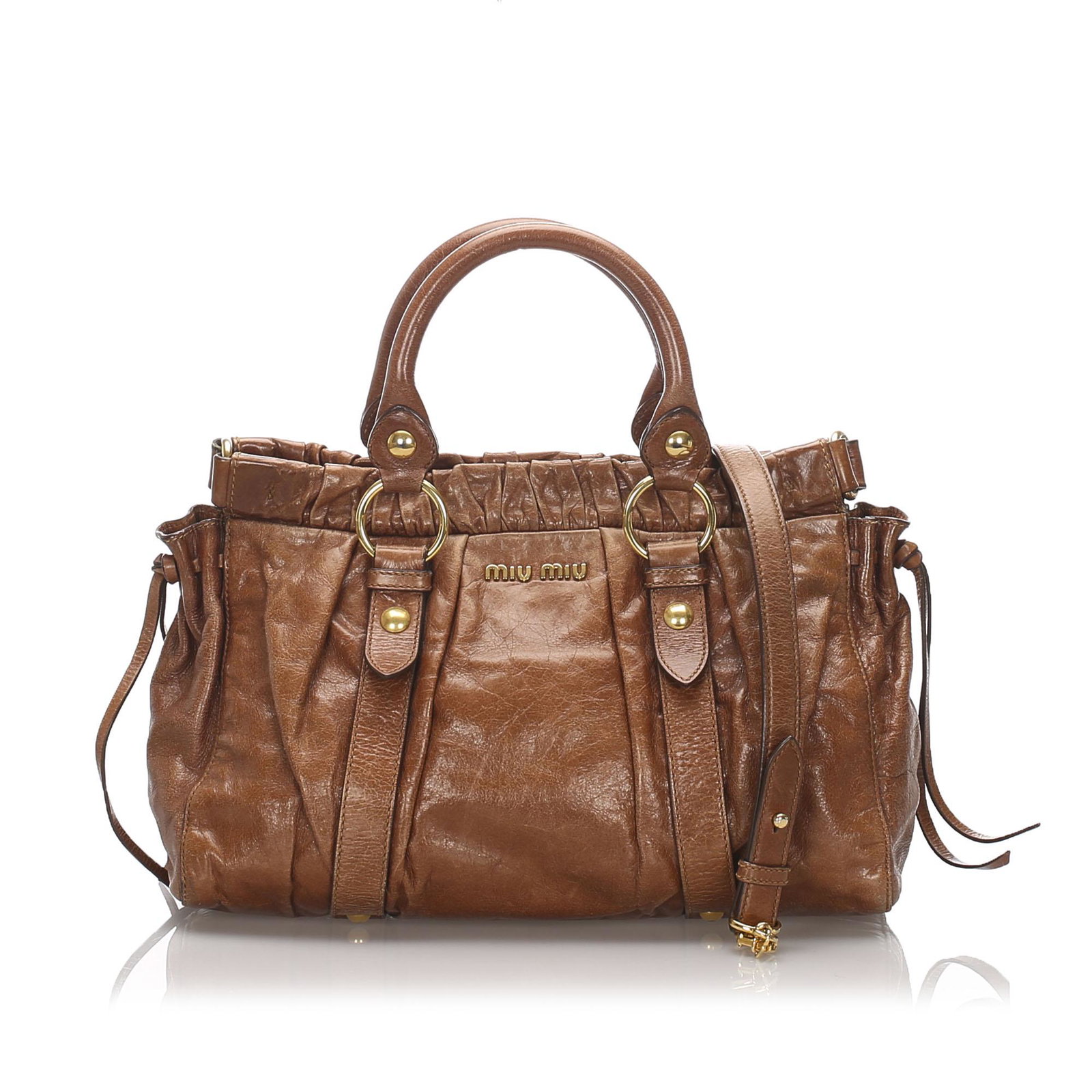 Authentic Miu Miu Gathered Leather Handbag: This handbag features a leather body with gathered top, rolled leather handles, an open top with magnetic snap button closure, and interior zip and slip pockets. Brand: Miu Miu Model: Gathered Leather
