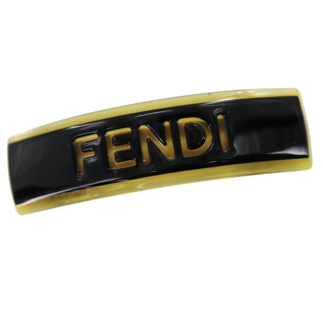 Authentic FENDI VINTAGE Plastic, Gold-Plated Hair Clamp: Brand: FENDI Material: Plastic, Gold-Plated Style: Hair clamp Color: Black, Gold Size(Inch): H 0.9 x L 3.5 Country of Origin: France Come with: - All Bidhaus items come with a 100% money-back authenti
