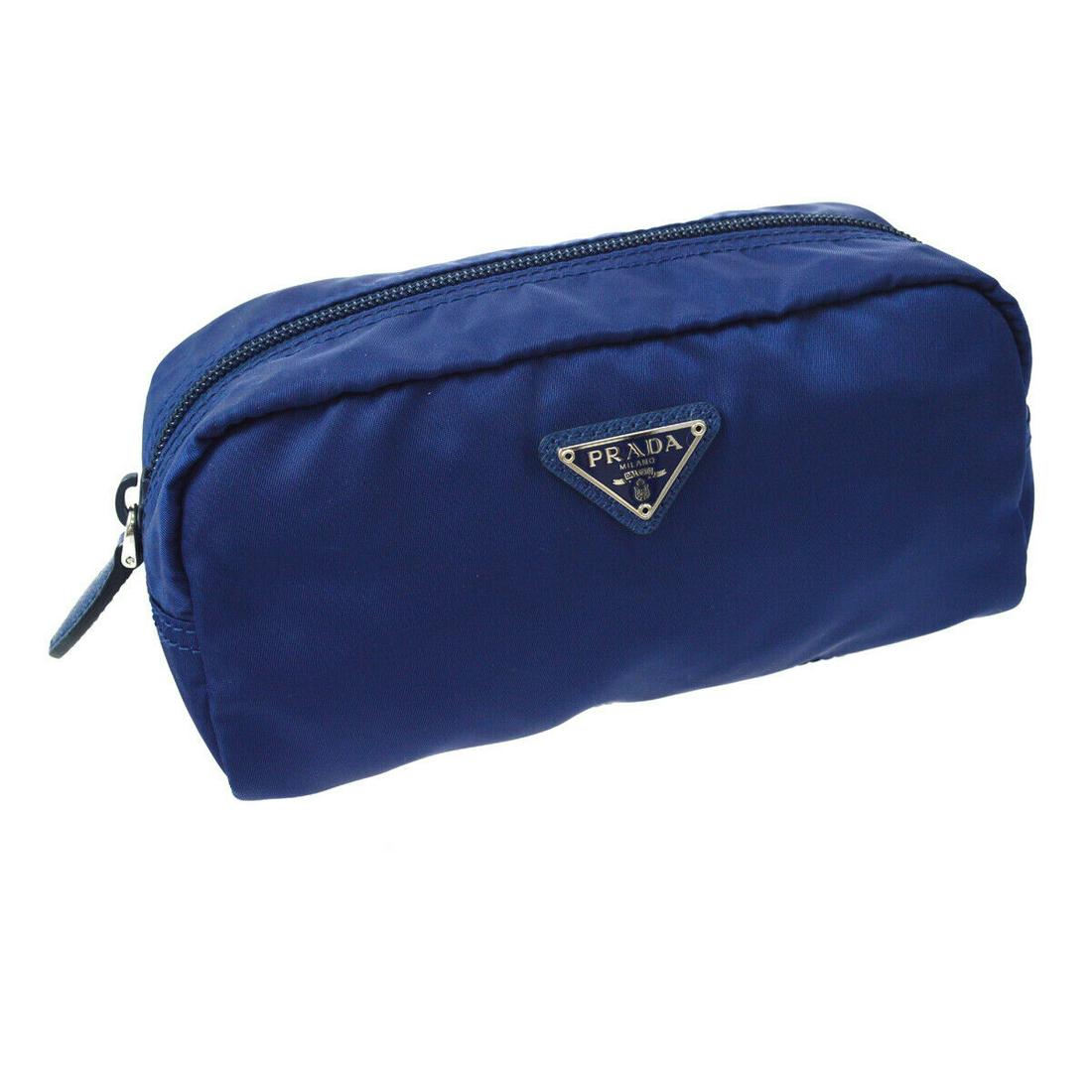 Authentic PRADA Nylon Cosmetic Pouch: Brand: PRADA Material: Nylon Style: Cosmetic Pouch Color: Blue Size(inch): W7 in x H4 in x D2 in " Size(inch): W 7.1 x H 3.5 x D 2.4 " Come with: Dust Bag All Bidhaus items come with a 100% money-back