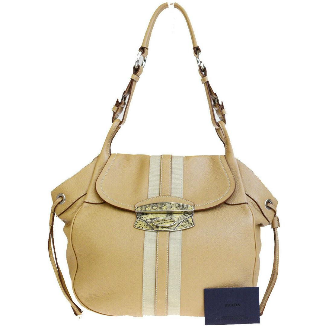 Authentic PRADA Canvas, Leather, Lizard Skin Leather: Brand: PRADA Material: Canvas, Leather, Lizard Skin Leather Style: Shoulder Bag Color: Beige Size(inch): W 16.1 x H 12.2 x D 4.3 "(approx.) Country of Origin: Italy Come with: Authenticity Card All Bi