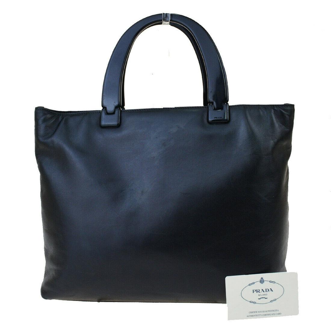 Authentic PRADA Leather Hand Bag: Brand: PRADA Material: Leather Style: Hand Bag Color: Black Size(inch): W 11.4 x H 9.4 x D 3.9 "(approx.) Country of Origin: Italy Come with: Authenticity Card All Bidhaus items come with a 100% money