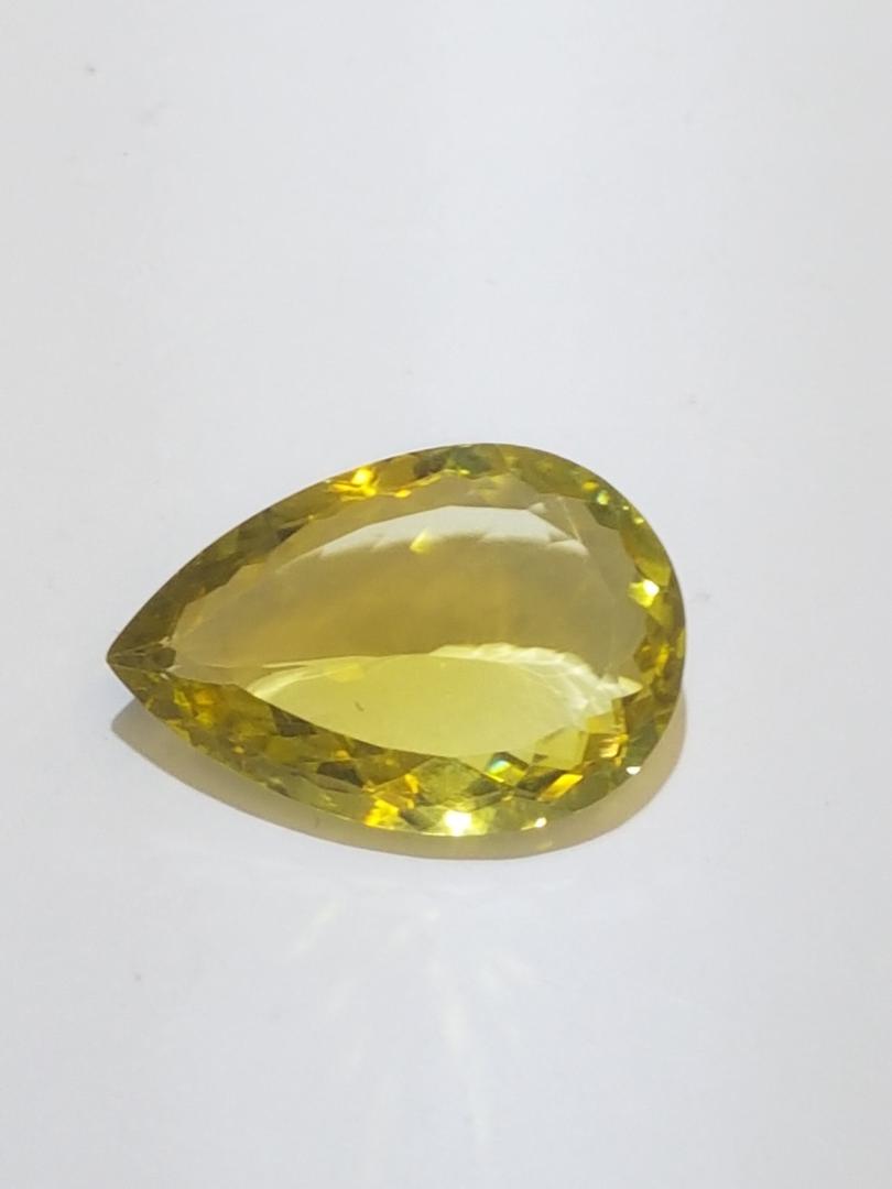 Genuine Lemon Quartz Pear Cut 24.15 Cts: Lemon Quartz Clean Quality Stone: Lemon Quartz Quantity: Size: 28.70 mm x 19.10 mm x 8.25 mm Style: Pear Cut CTW: 24.15 Cut: Pear Treatment: Gamma Clarity: Loope Clean All Bidhaus items come with a 10