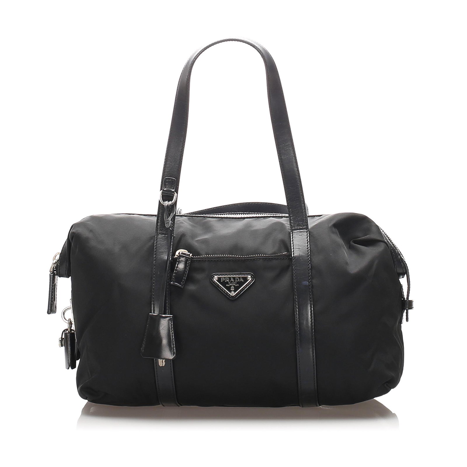 Authentic Prada Tessuto Tote Bag: This tote bag features a nylon body with leather trim, a front exterior zip pocket, flat leather straps, a top zip closure, and an interior zip pocket. Brand: Prada Model: Tessuto Tote Bag Origin: Ita