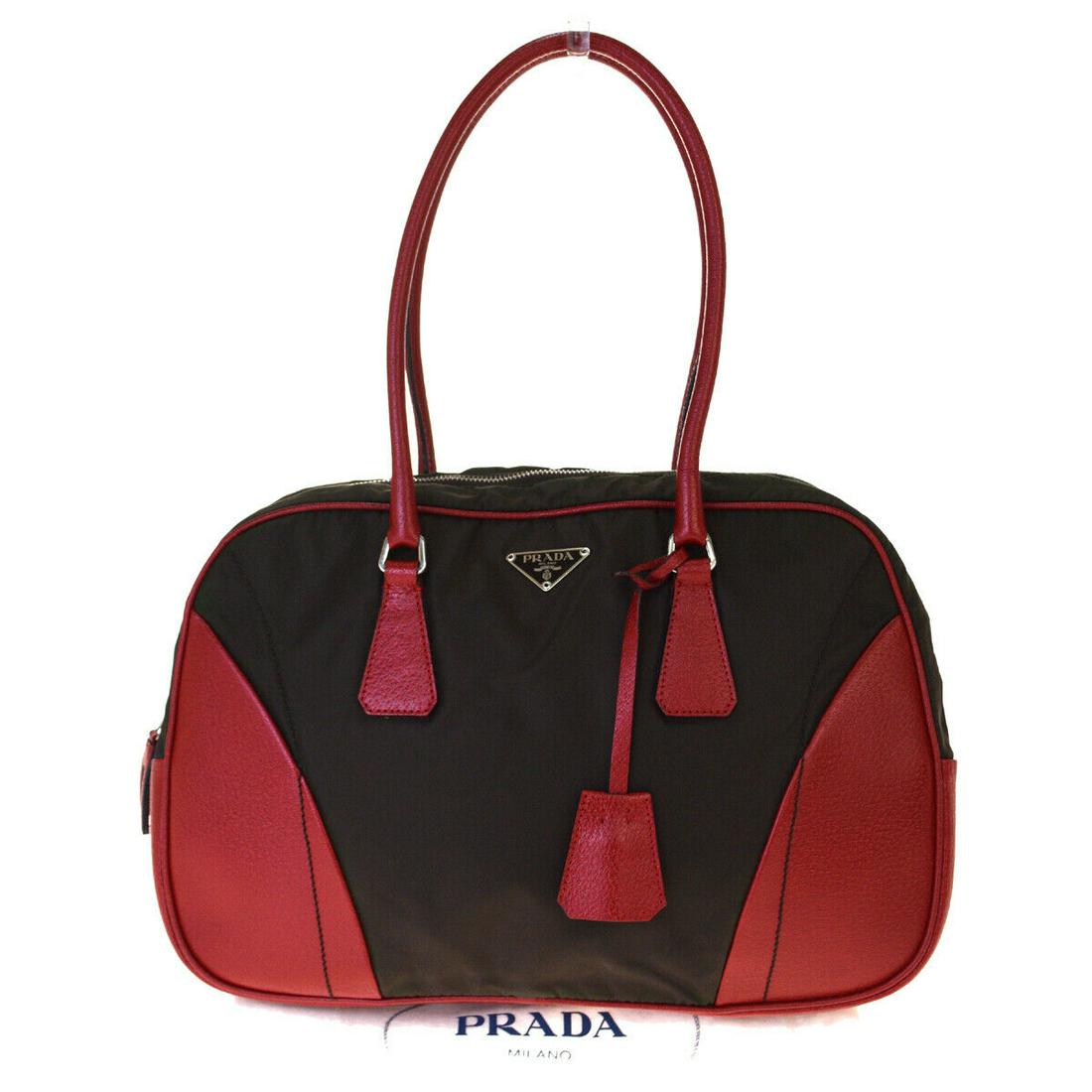 Authentic PRADA Leather, Nylon Shoulder bag: Brand: PRADA Material: Leather, Nylon Style: Shoulder bag Color: Khaki Size(inch): W 13.4 x H 9.4 x D 4.3 "(approx.) Country of Origin: Italy Come with: Dust bag All Bidhaus items come with a 100% mon