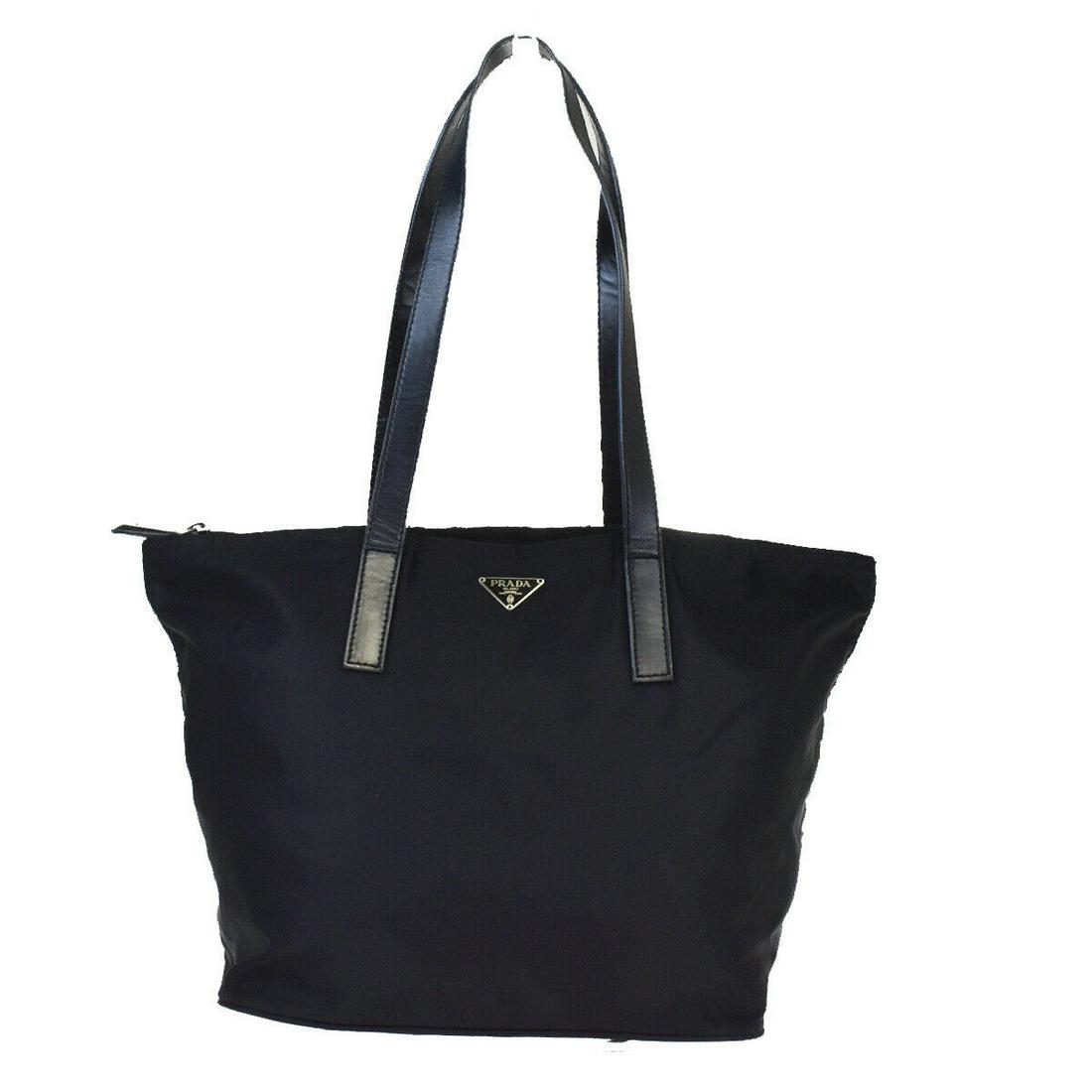 Authentic PRADA Leather, Nylon Shoulder bag: Brand: PRADA Material: Leather, Nylon Style: Shoulder bag Color: Black Size(inch): W 13.8 x H 8.7 x D 7.1 "(approx.) Country of Origin: Italy Come with: - All Bidhaus items come with a 100% money-back