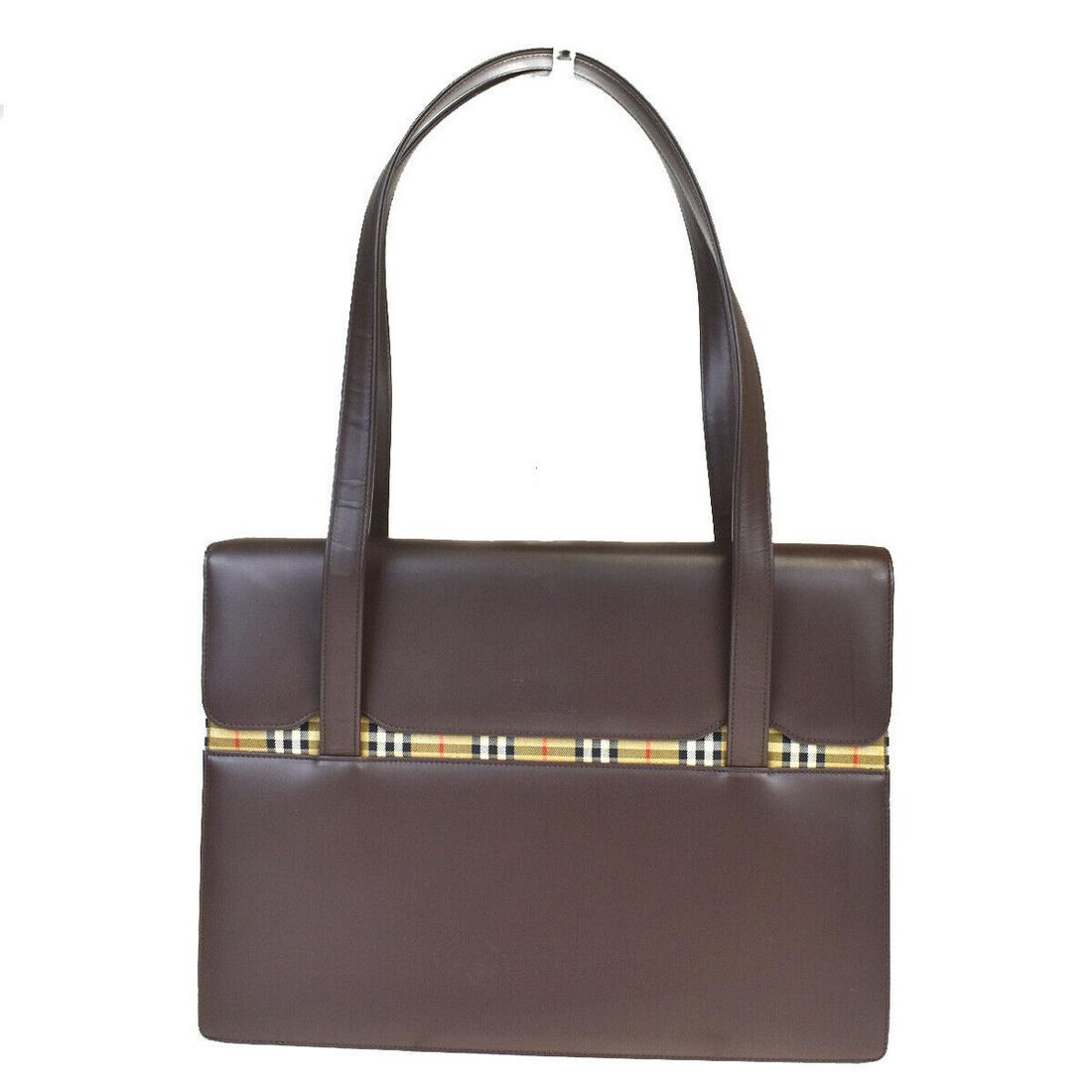 Authentic BURBERRY Leather, Canvas Shoulder Bag: Brand: BURBERRY Material: Leather, Canvas Style: Shoulder Bag Color: Brown Size(inch): W 13.4 x H 9.4 x D 3.1 "(approx.) Country of Origin: JP Licence Come with: 0 All Bidhaus items come with a 100% m