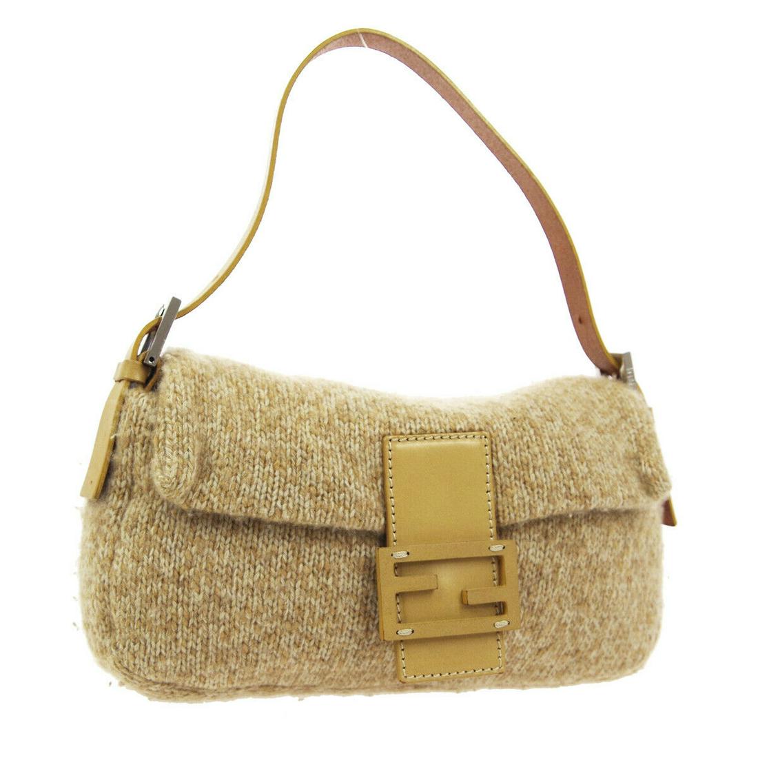Authentic FENDI BAGUETTE Wool, Leather Hand Bag: Brand: FENDI Material: Wool, Leather Style: Hand Bag Color: Beige Size(inch): W9.8 x H5.1 x D1.8 " Size(inch): W 9.8 x H 5.1 x D 1.8 "Handle Drop. 4.7 - 7.1 " Country of Origin: Italy Come with: - All
