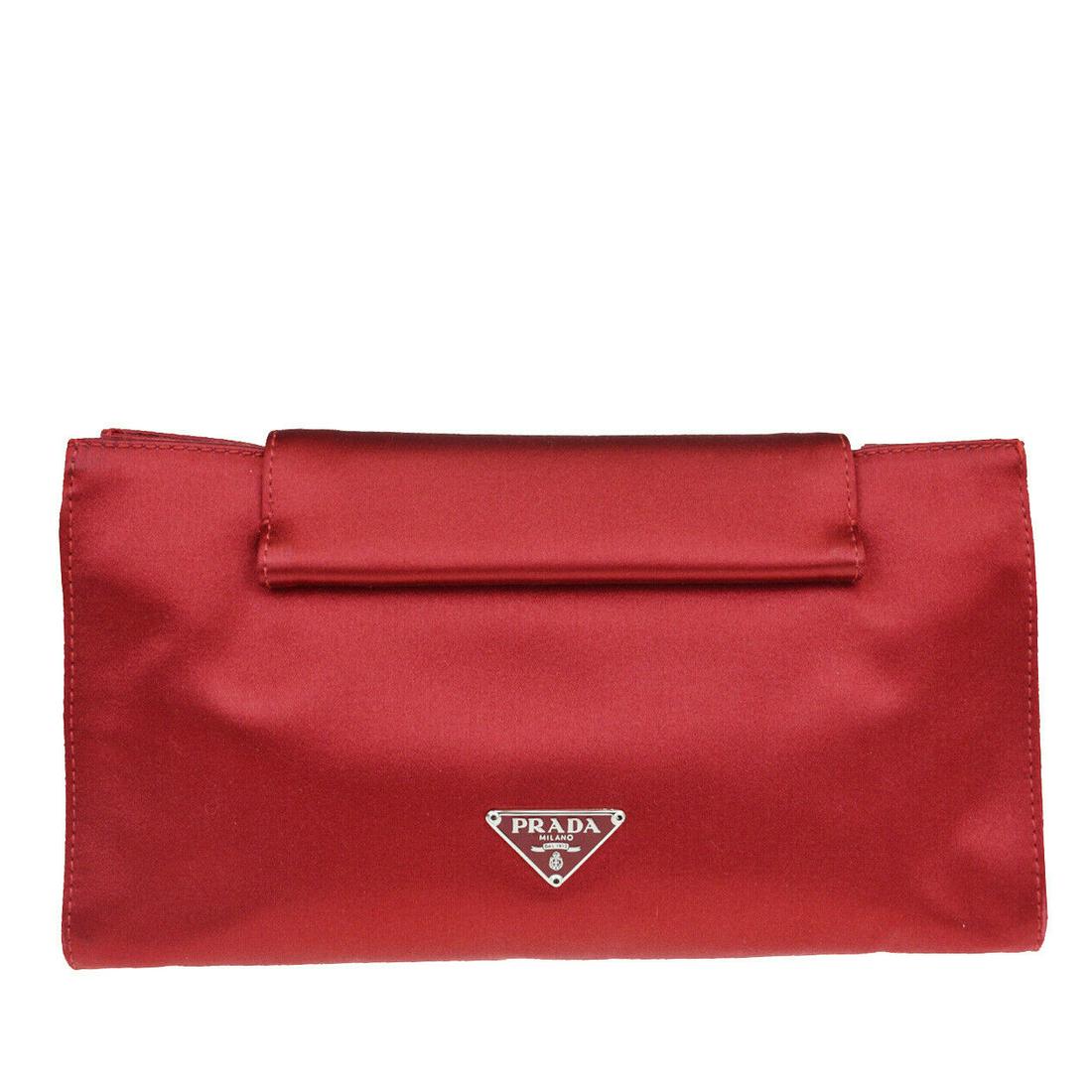 Authentic PRADA Satin Clutch Bag: Brand: PRADA Material: Satin Style: Clutch Bag Color: Red Size(inch): W 8.7 x H 4.7 x D 2.6 "(approx.) Country of Origin: Italy Come with: - All Bidhaus items come with a 100% money-back authenticity 