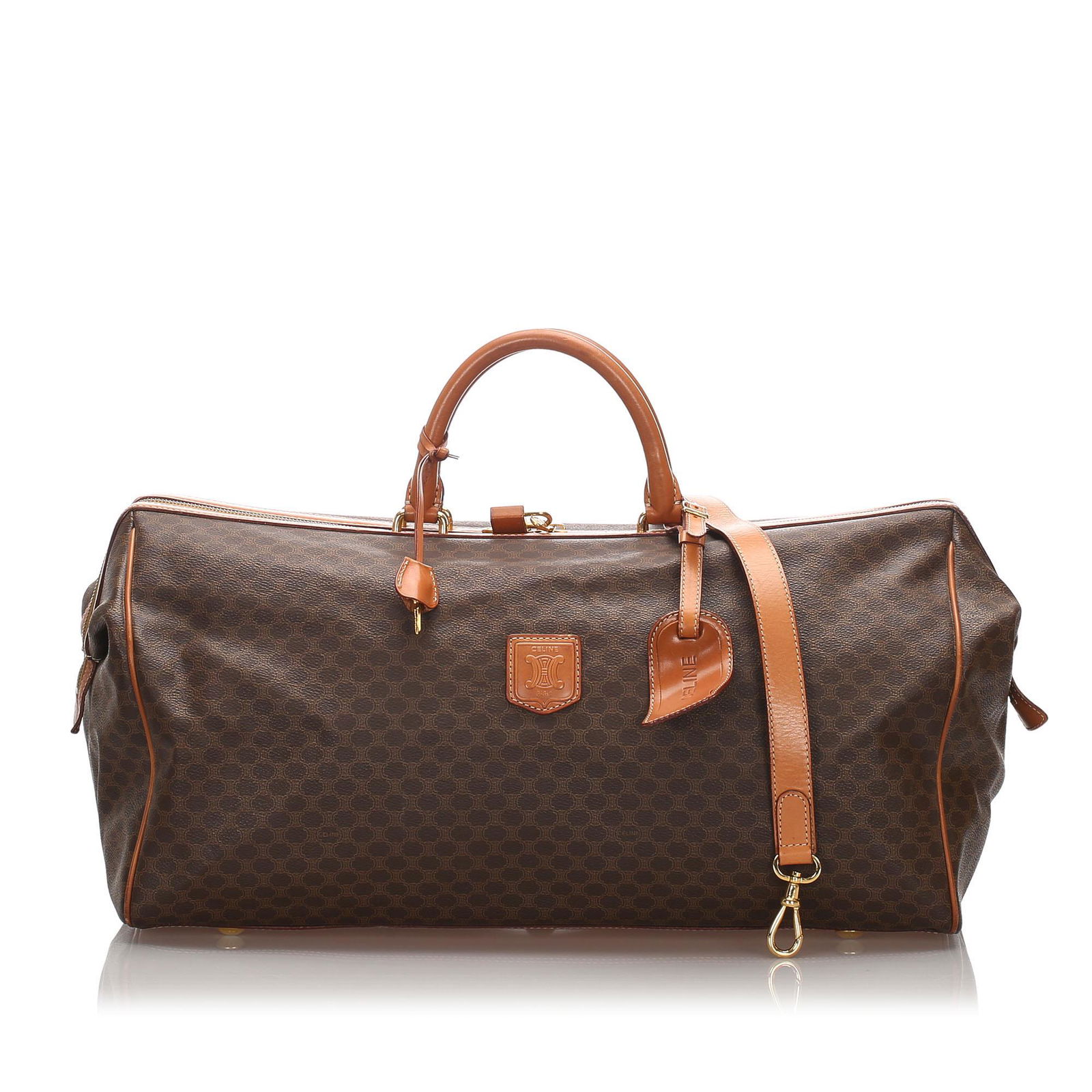 Authentic Celine Macadam Travel Bag: This travel bag features a PVC body with leather trim, rolled leather handles, a top zip closure, and an interior zip pocket.Brand: Celine Model: Macadam Travel Bag Origin: France Style: Macadam Categ