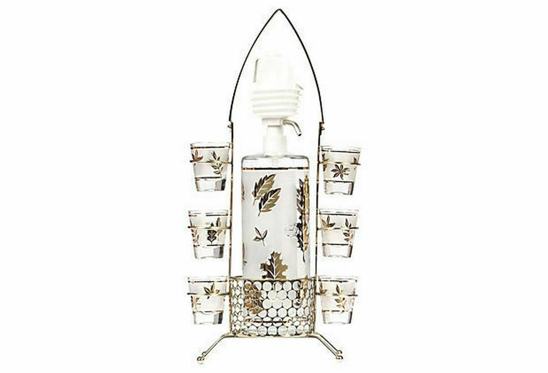 Authentic Spritzer Shot Glasses & Caddy Set: Circa, 1960Ã¢€â„¢sÃ¢€Â¦. Frosted, 1.5 oz shot glasses set of six and 32 oz spritzer with 18 kt gold leafing motif of leaves with caddyÃ¢€Â¦. Mint condition, clean and pump