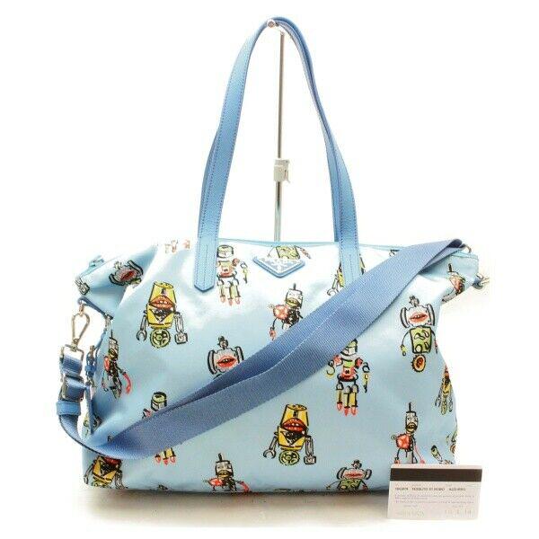 Authentic PRADA Nylon Hand Bag: Brand: PRADA Material: Nylon Style: Hand Bag Color: Blue Size(inch): W13.7 inch(approx) /35 cm(approx) x H11.0 inch(approx) /28 cm(approx) x D5.90 inch(approx) /15 cm(approx) " / Strap Drop: Shoulder 