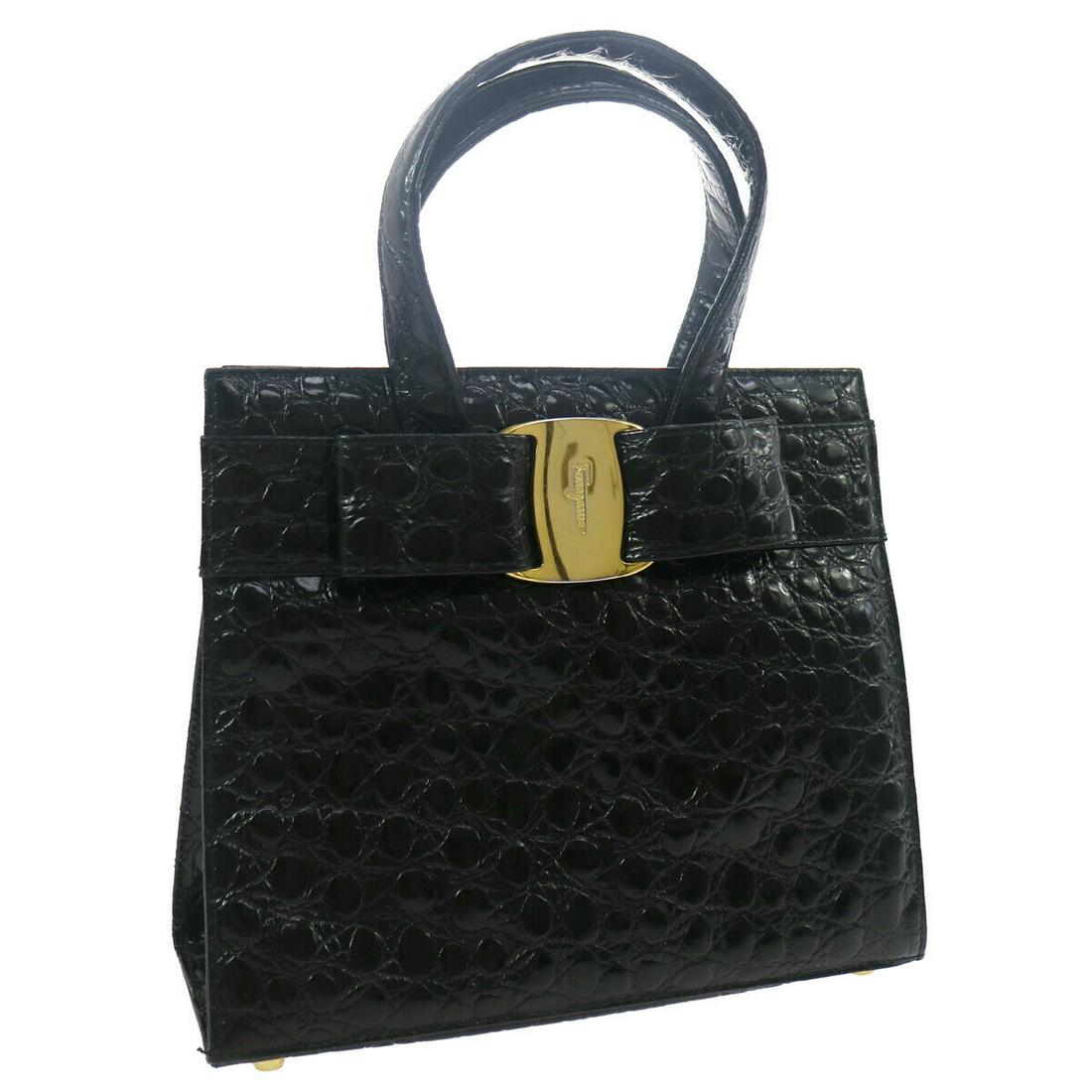 Authentic SALVATORE FERRAGAMO Embossed Leather Hand Bag: Brand: SALVATORE FERRAGAMO Material: Embossed Leather Style: Hand Bag Color: Black Size(inch): W9.6 x H8.5 x D3.9 " Country of Manufacture: Italy Come with: Shoulder Strap All Bidhaus items come with