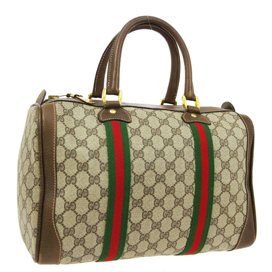 Authentic GUCCI PVC, Leather Boston Hand Bag: Brand: GUCCI Material: PVC, Leather Style: Boston Hand Bag Color: Brown, Red, Green Size(inch): W13.0 x H8.3 x D6.3 " / Strap Drop: 4.7 Size(inch): W 13.0 x H 8.3 x D 6.3 "Handle Drop. 4.7 " Country o