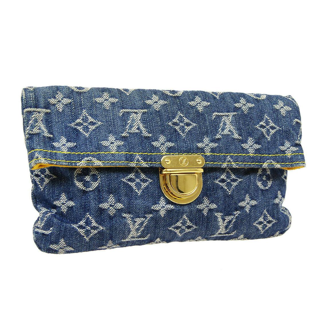 Authentic LOUIS VUITTON Monogram Denim Canvas, Leather: Brand: LOUIS VUITTON Material: Monogram Denim Canvas, Leather Style: Clutch Color: Indigo, Brown Size(inch): W9.1 x H5.5 x D0.8 " Size(inch): W 9.1 x H 5.5 x D 0.8 " Country of Origin: France Come wit
