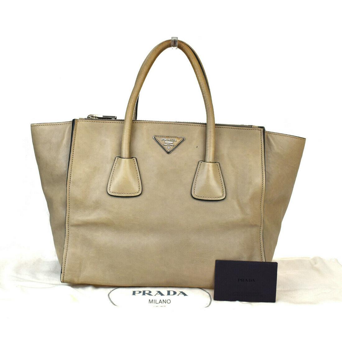 Authentic PRADA Leather, Nylon Shoulder bag: Brand: PRADA Material: Leather, Nylon Style: Shoulder bag Color: Black Size(inch): W 11.8 x H 9.8 x D 7.9 "(approx.) Country of Origin: Italy Come with: Dust bag,Authenticity Card All Bidhaus items co