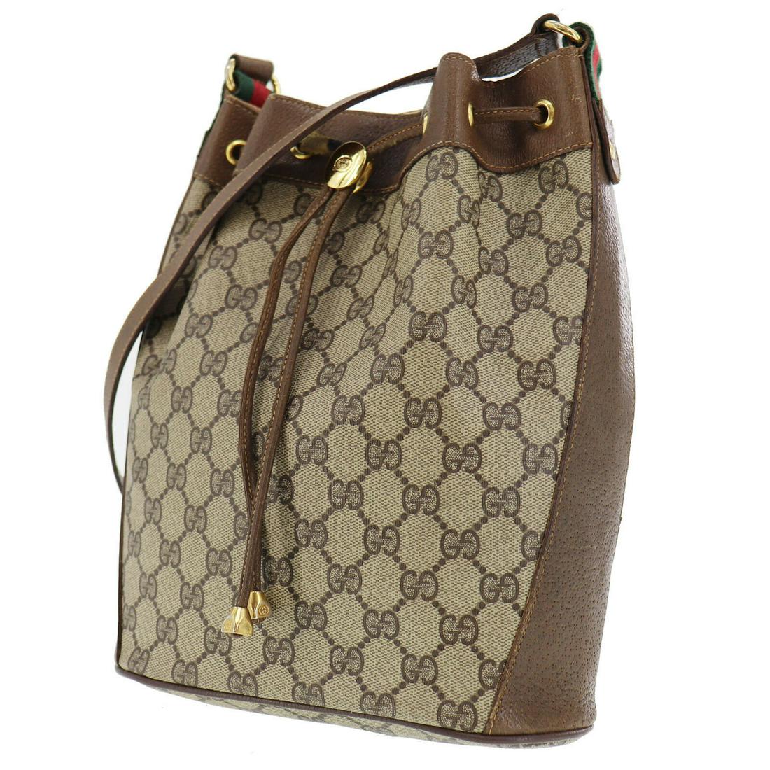 Authentic GUCCI VINTAGE PVC Leather Shoulder Bag: Brand: GUCCI Material: PVC Leather Style: Shoulder Bag Color: Brown Size(Inch): H 10.6 Ã—D 3.9 x L 8.6Shoulder: 32.2 - 35.8 Country of Origin: Italy Come with: - All Bidhaus items come with a 100% 