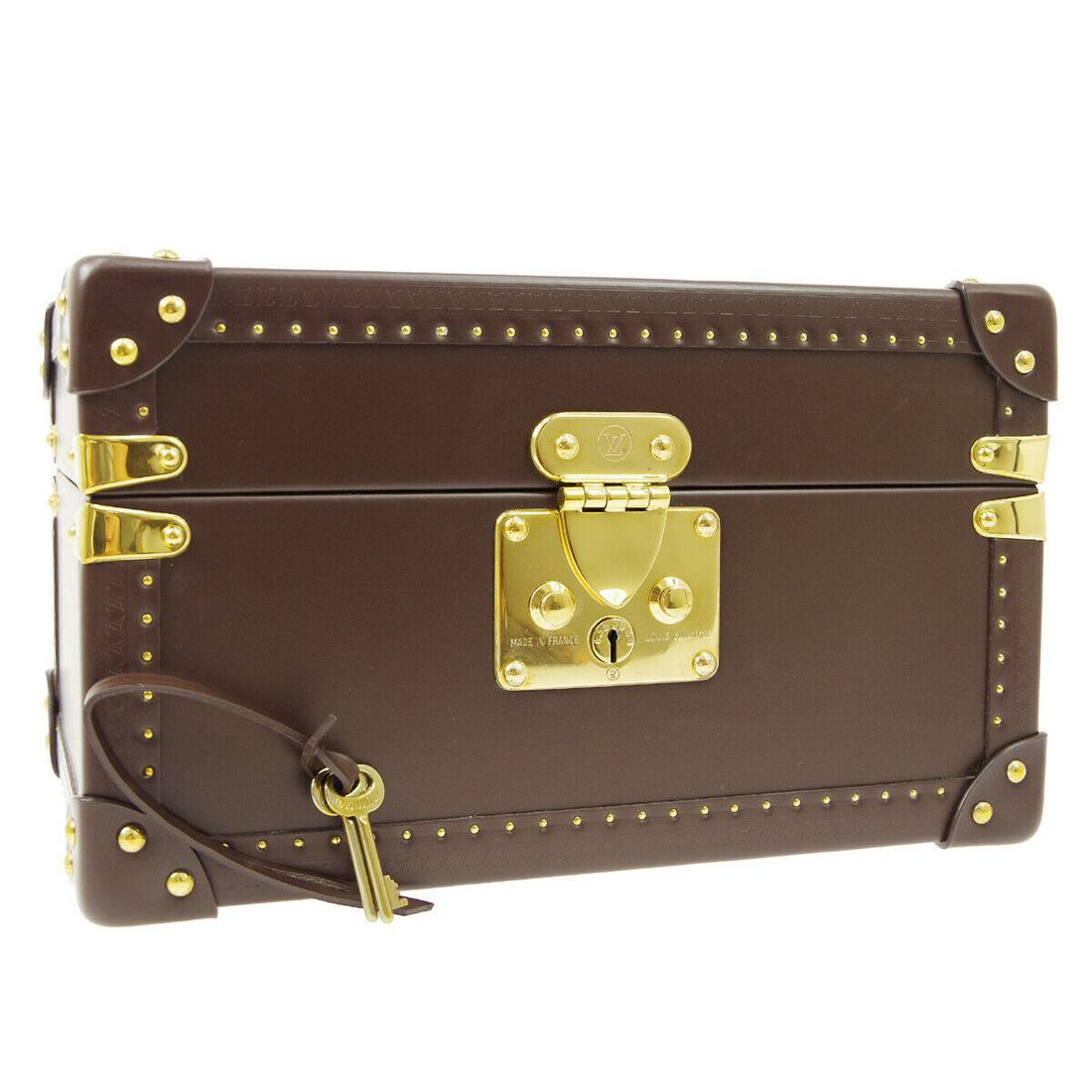 Authentic LOUIS VUITTON Leather JEWELRY BOX: Brand: LOUIS VUITTON Material: Leather Style: JEWELRY BOX Color: Brown Size(inch): W12.6 x H7.5 x D8.7 " Size(inch): W 12.6 x H 7.5 x D 8.7 " Country of Origin: France Come with: Keys*2, Unopened Clot