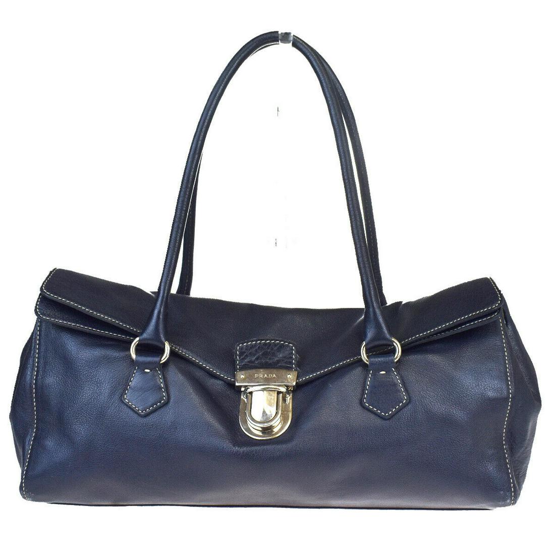 Authentic PRADA Leather Shoulder Bag: Brand: PRADA Material: Leather Style: Shoulder Bag Color: Navy Blue Size(inch): W 13.4 x H 6.7 x D 4.7 "(approx.) Country of Origin: Italy Come with: - All Bidhaus items come with a 100% money-back au