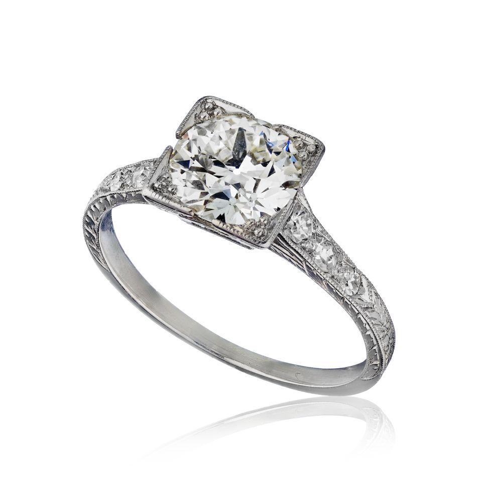 Platinum Solitaire: Type:Solitaires Metal:Platinum Grams:2.6 Approximate Diamond Weight:1.1 Cts Other Details:& 7 side stones in Antique MTG
