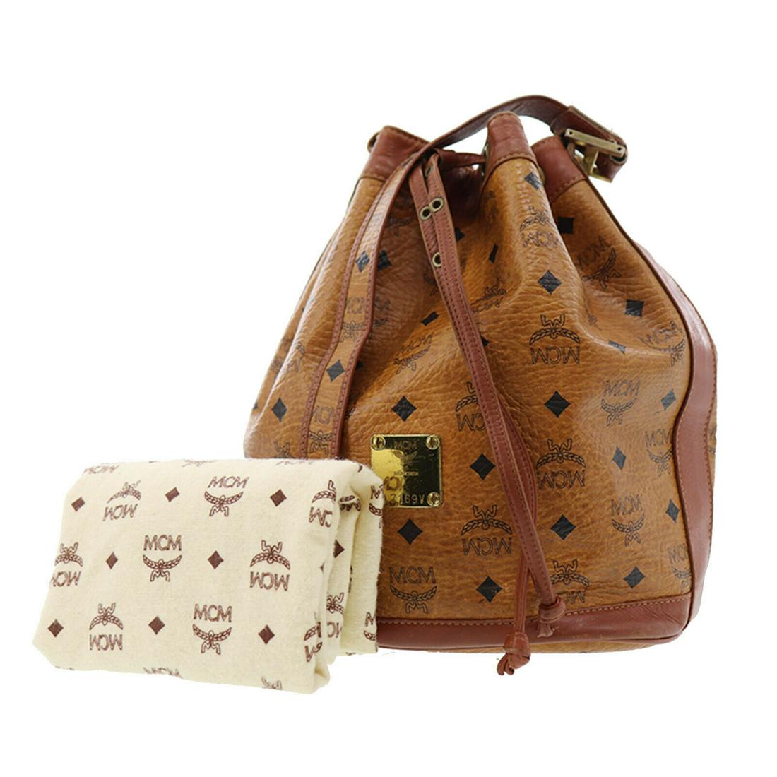 Authentic MCM Coated Canvas Leather Shoulder Bag: Brand: MCM Material: Coated Canvas Leather Style: Shoulder Bag Color: Brown Size(Inch): H 11.6 x D 6.6 x L 8.8Shoulder : 36.2-43.1 Country of Origin: Germany Come with: Dust Bag. Padlock. (Missing Key