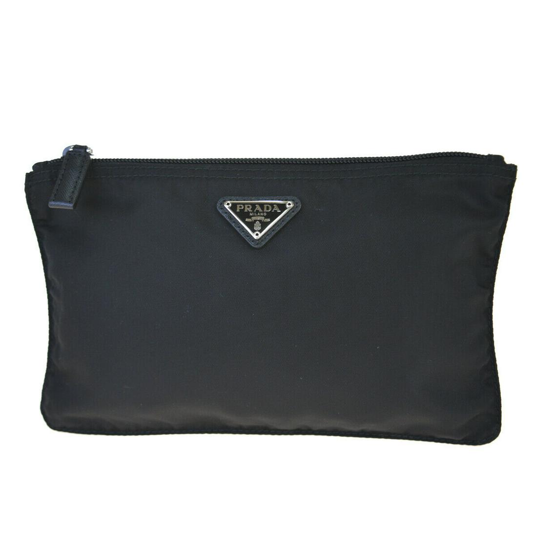 Authentic PRADA Nylon Pouch: Brand: PRADA Material: Nylon Style: Pouch Color: Black Size (HxWxD): 14cm x 23cm x 5mm / 5.51'' x 9.05'' x 0.19'' Country of Origin: Italy All Bidhaus items come with a 100% money-back authenticity gu