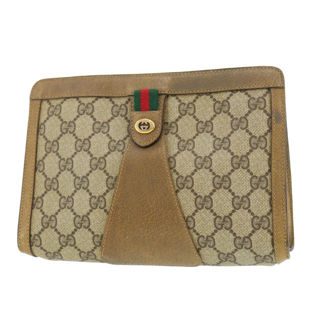 Authentic GUCCI PVCLeather Clutch: Brand: GUCCI Material: PVCLeather Style: Clutch Color: Brown Size(Inch): H 6.2 x D 2.74 x L 8.8 Country of Origin: Italy Come with: - All Bidhaus items come with a 100% money-back authenticity guarant