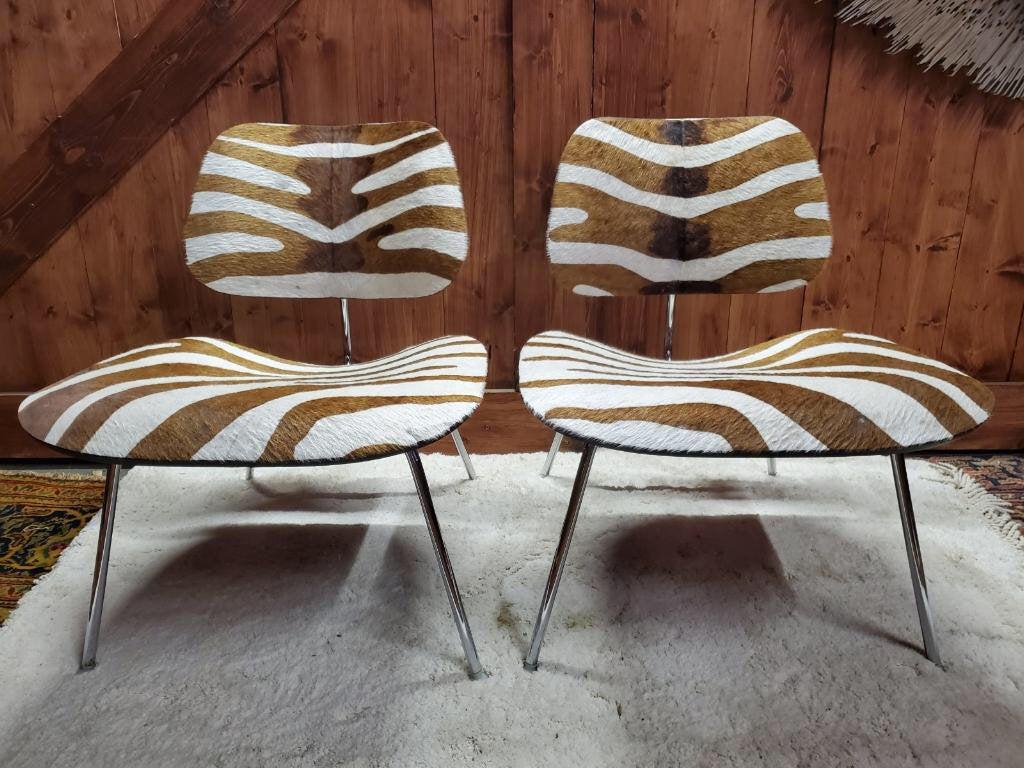 Mid Century Modern Herman Miller Eames LCW Chairs Newly: Mid Century Modern Herman Miller Eames LCW Molded Plywood Lounge Chairs Custom Upholstered In Zebra Pattern Hide - Pair Circa 1950 H 26" W 22" D 19" Seat H 15" Great condition Please be aware that all