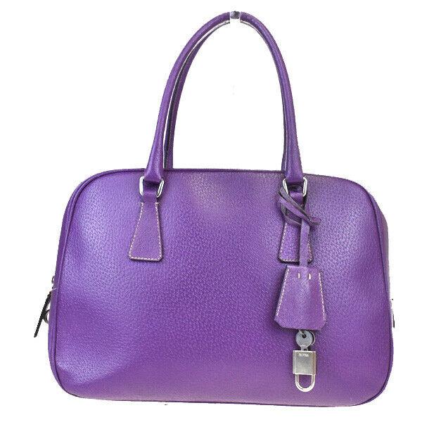Authentic PRADA Leather Shoulder Bag: Brand: PRADA Material: Leather Style: Shoulder Bag Color: Purple Size(inch): W 11.8 x H 7.9 x D 4.7 "(approx.) Country of Origin: Italy Come with: Padlock,Key*2 All Bidhaus items come with a 100% mone