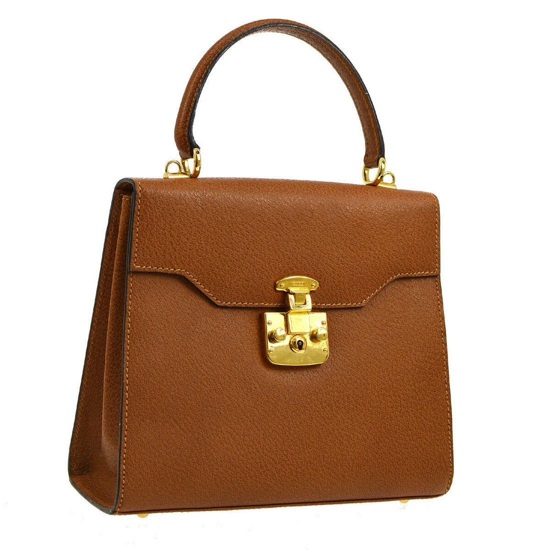Authentic GUCCI Leather Handbag: Brand: GUCCI Material: Leather Style: Handbag Color: Brown Size(inch): W9.4 x H7.9 x D3.5 " / Strap Drop: 3.9 or 19.3 Size(inch): W 9.4 x H 7.9 x D 3.5 "Handle Drop. 3.9 " Country of Origin: Italy Com
