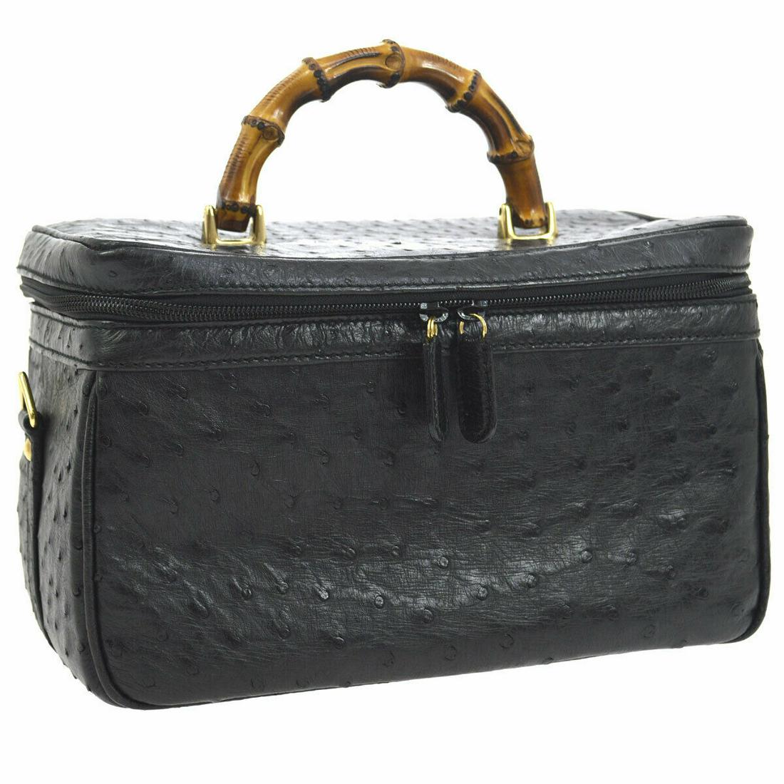 Authentic GUCCI Ostrich Cosmetic Bags: Brand: GUCCI Material: Ostrich Style: Cosmetic Bags Color: Black Size(inch): W11.4 x H7.5 x D5.9 " / Strap Drop: 17.7 - 19.7 Size(inch): W 11.4 x H 7.5 x D 5.9 "Handle Drop. 3.5 "Strap Drop. 17.7 - 19