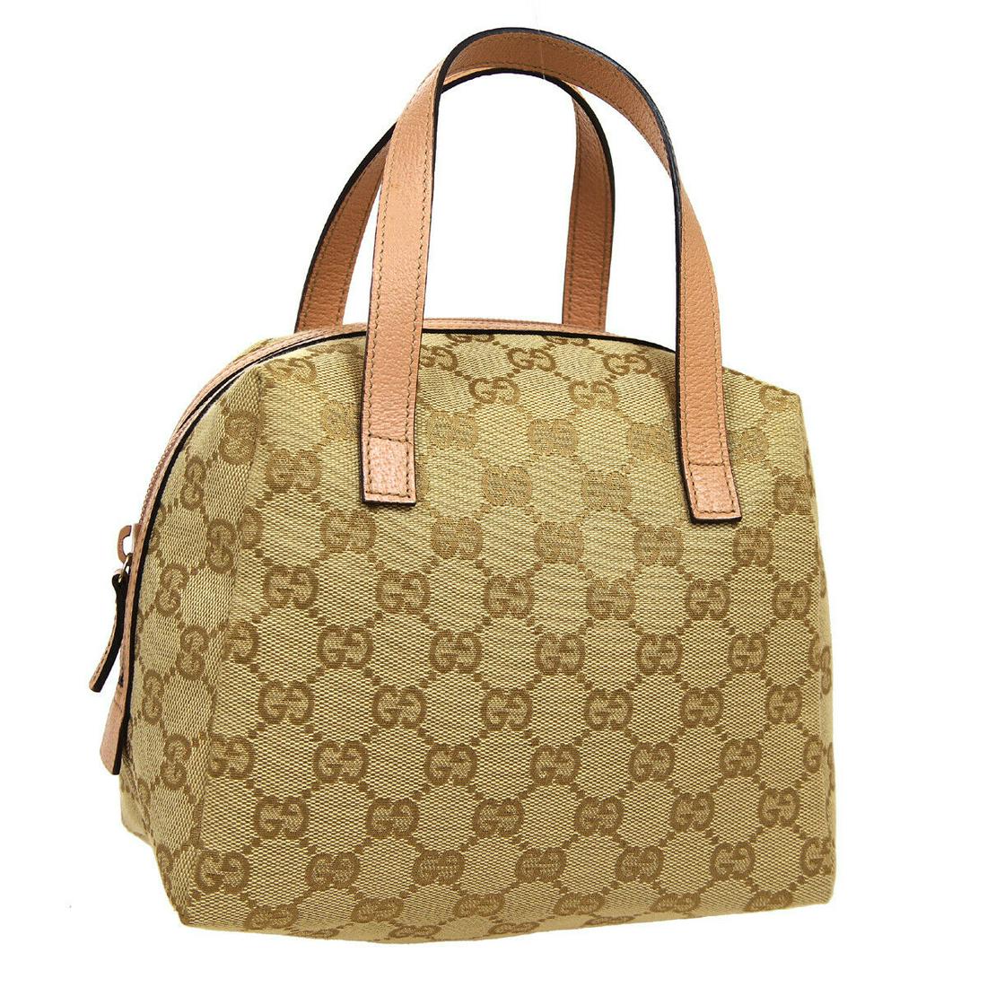 Authentic GUCCI Canvas, Leather Hand Bag: Brand: GUCCI Material: Canvas, Leather Style: Hand Bag Color: Beige, Pink Size(inch): W7.5 x H5.9 x D4.3 " Size(inch): W 7.5 x H 5.9 x D 4.3 "Handle Drop. 3.5 " Country of Origin: Italy Come with: - A