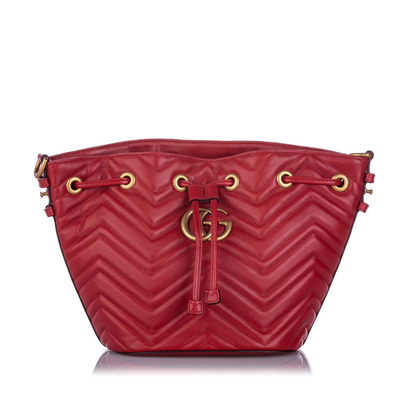 Authentic Gucci GG Marmont Bucket Bag: This bucket bag features a leather body a flat top handle a detachable canvas shoulder strap a drawstring closure and interior slip pockets. Brand: Gucci Model: GG Marmont Bucket Bag Origin: ITALY Cat