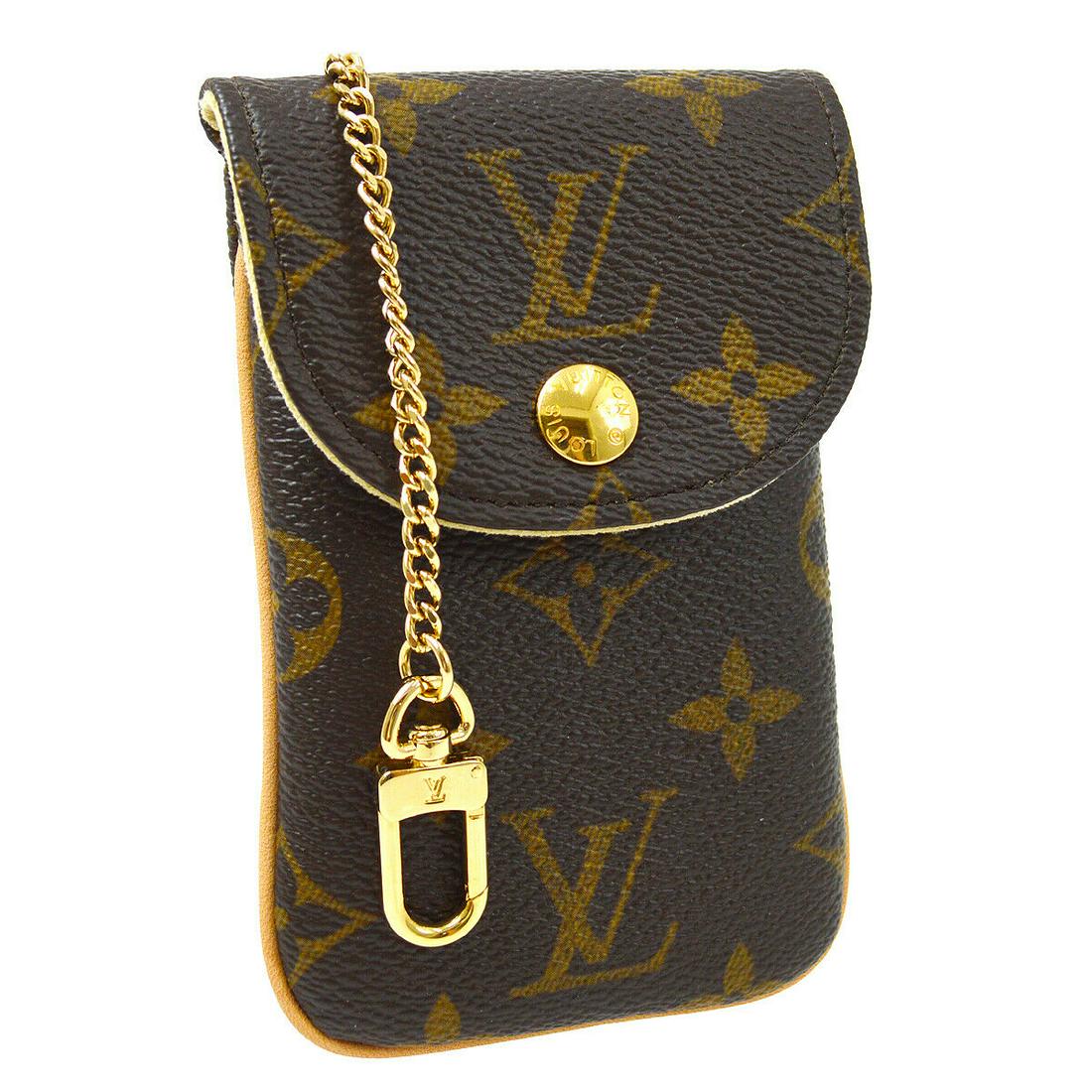 Authentic LOUIS VUITTON Monogram Canvas, Leather Pouch: Brand: LOUIS VUITTON Material: Monogram Canvas, Leather Style: Pouch Bag Color: Brown Size(inch): W3 in x H5 in x D1 in " Size(inch): W 3.1 x H 5.1 x D 0.4 " Country of Origin: France Come with: Box,