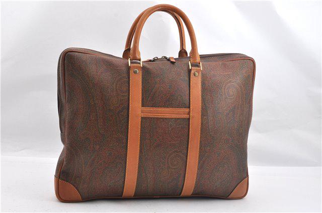 Authentic ETRO PVC/Leather Brief Case: Brand: ETRO Material: PVC/Leather Style: Brief Case Color: Brown Size(inch): W17.1 x H13.2 x D2" / Handle Drop 4.1"(Approx) Country of Origin: Italy Accessory: There is no ItemBox and DustBag.We will