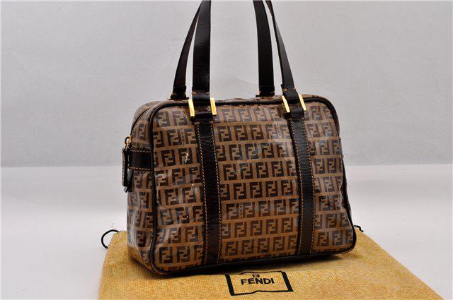 Authentic FENDI PVC Hand Bag: Brand: FENDI Material: PVC Style: Hand Bag Color: Brown Size(inch): W10.2 x H7.5 x D4.1" / Handle Drop 5.9"(Approx) Country of Origin: Italy Accessory: DustBag All Bidhaus items come with a 100% money