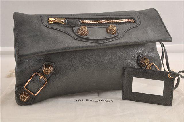 Authentic BALENCIAGA Leather Clutch Bag: Brand: BALENCIAGA Material: Leather Style: Clutch Bag Color: Dark Green Size(inch): W12.2 x H7.1 x D1"(Approx) Country of Origin: Italy Accessory: DustBag,Mirror All Bidhaus items come with a 100% mon