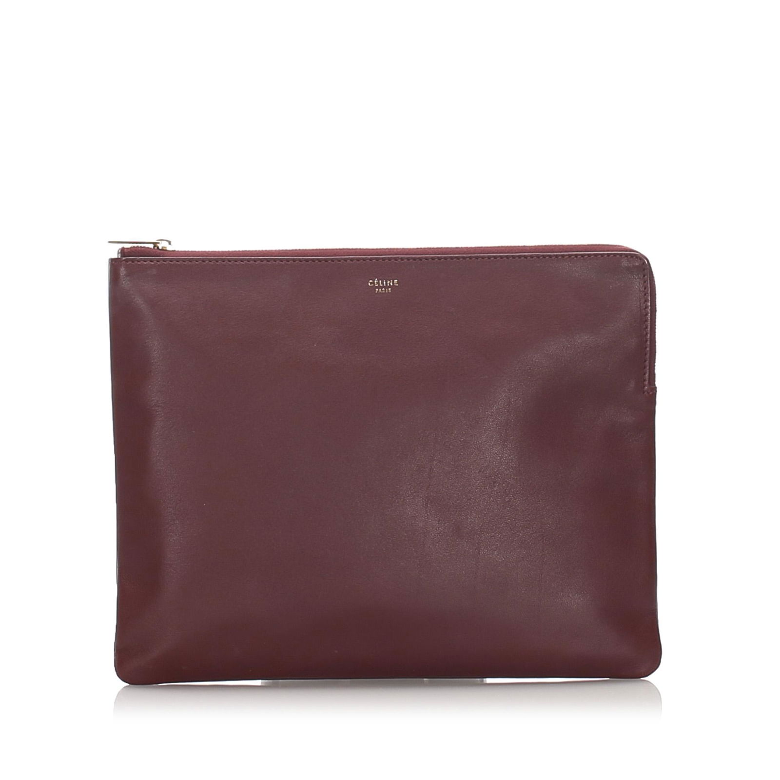 Authentic Celine Leather Clutch Bag: This clutch bag features a leather body and a top zip closure. Brand: Celine Model: Leather Clutch Bag Origin: France Category: Clutch Bag Color: Red x Burgundy Style: Others Material: Leather x Calf