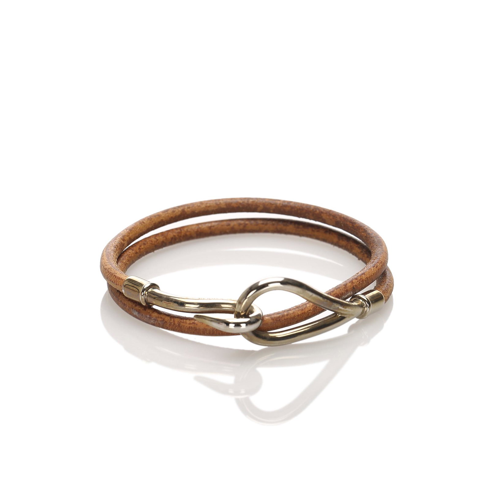 Authentic Hermes Jumbo Hook Leather Bracelet: The Jumbo Hook bracelet features a rolled leather strap and a silver tone metal hook closure. Brand: Hermes Model: Jumbo Hook Leather Bracelet Origin: France Category: Costume Bracelet Color: Brown x 