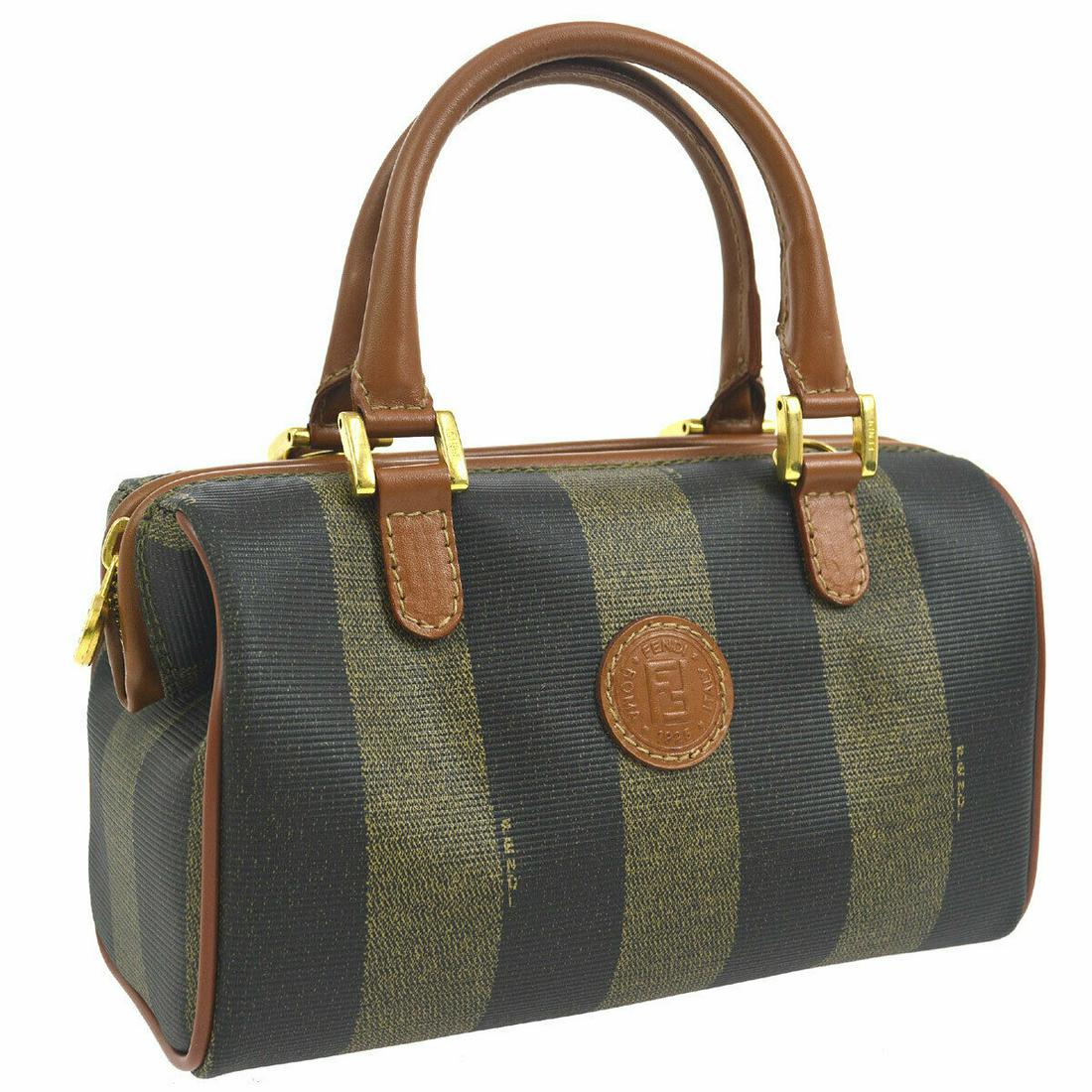 Authentic FENDI MINI PVC, Leather Hand Bag: Brand: FENDI Material: PVC, Leather Style: Hand Bag Color: Brown, Black Size(inch): W7.9 x H4.9 x D3.5 " Country of Origin: Italy Come with: Dust Bag All Bidhaus items come with a 100% money-back auth