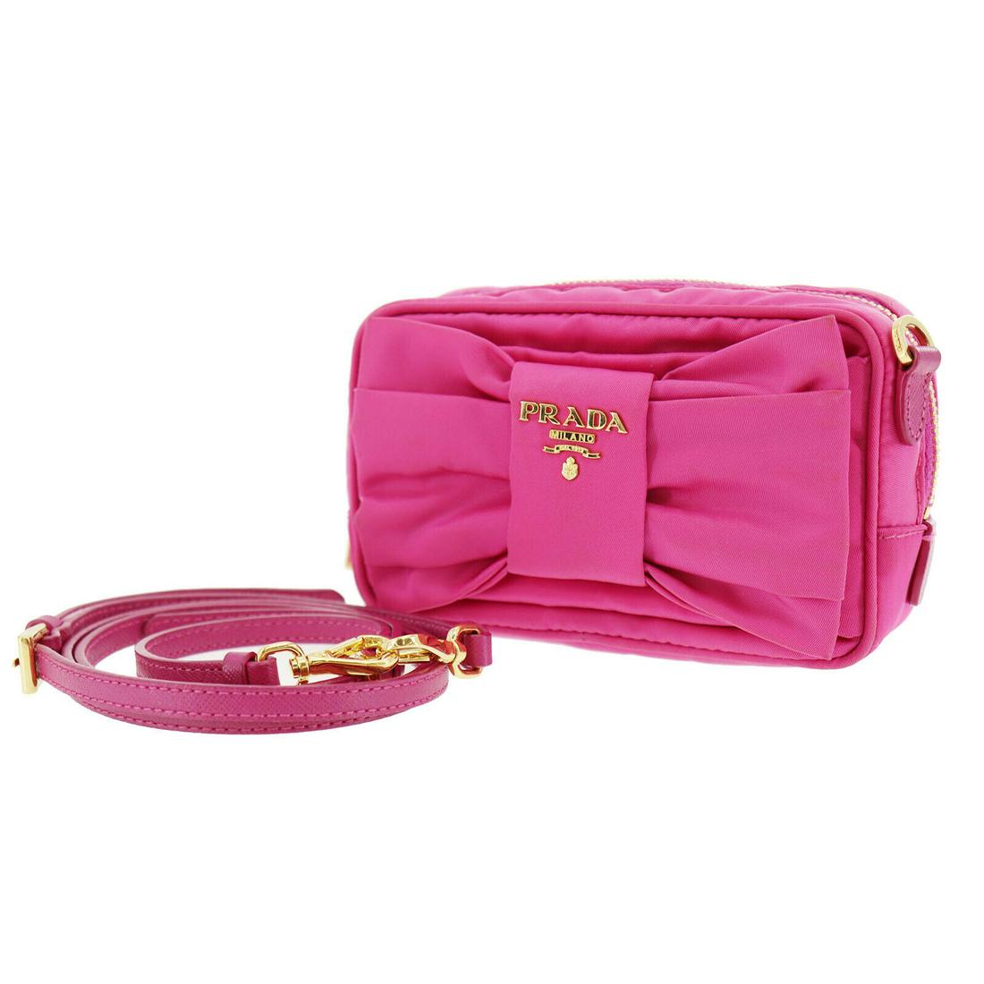 Authentic PRADA Nylon Shoulder Bag: Brand: PRADA Material: Nylon Style: Shoulder Bag Color: Pink Size(Inch): H 3.9 x D 1.9 x L 5.9Shoulder: 46.8-52.7 Country of Origin: Italy Come with: Shoulder Strap All Bidhaus items come with a 100% 