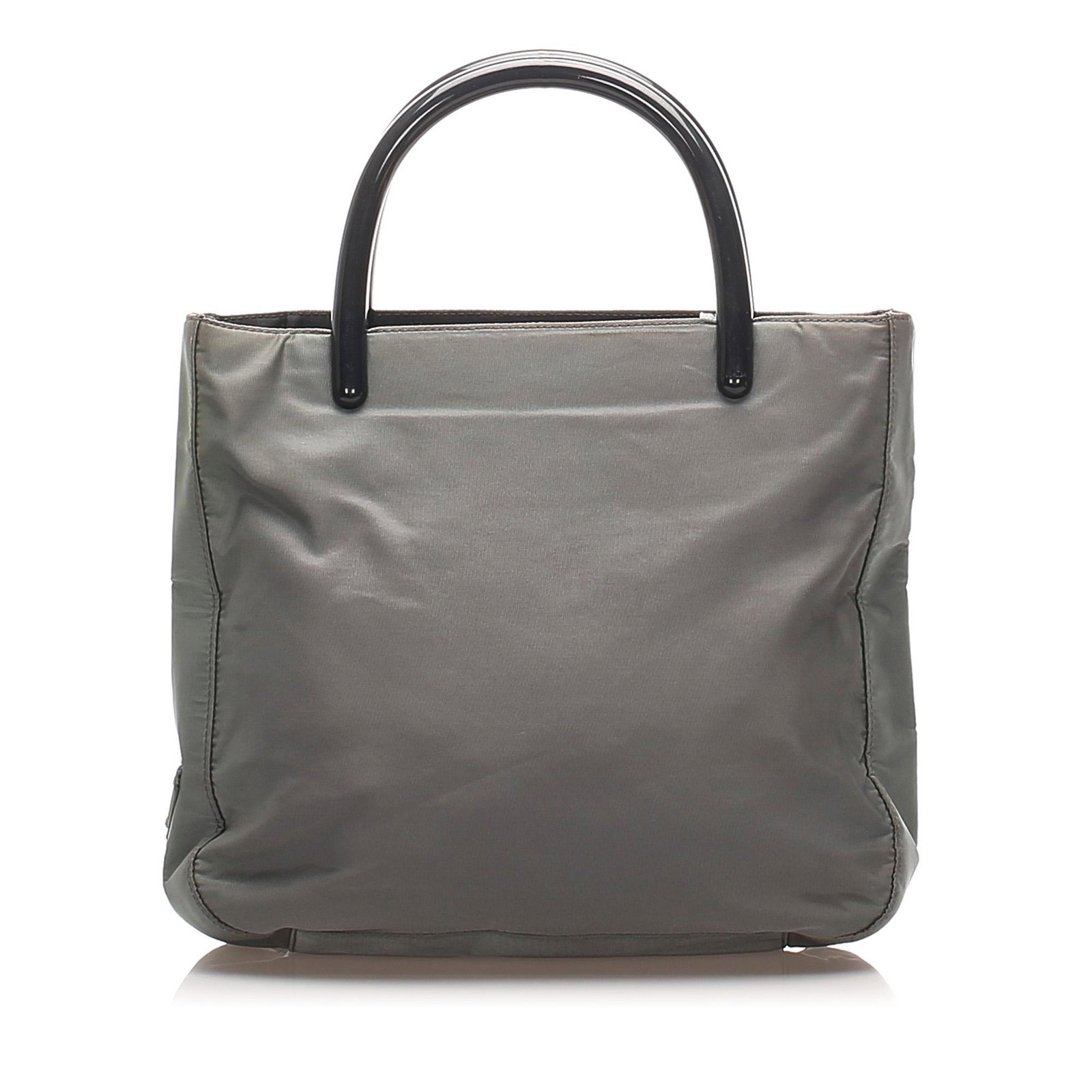 Authentic Prada Tessuto Handbag: This handbag features a nylon body a plastic handles an open top an interior zip compartment and an interior zip pocket. Brand: Prada Model: Tessuto Handbag Origin: Italy Category: Handbag Color: Gray