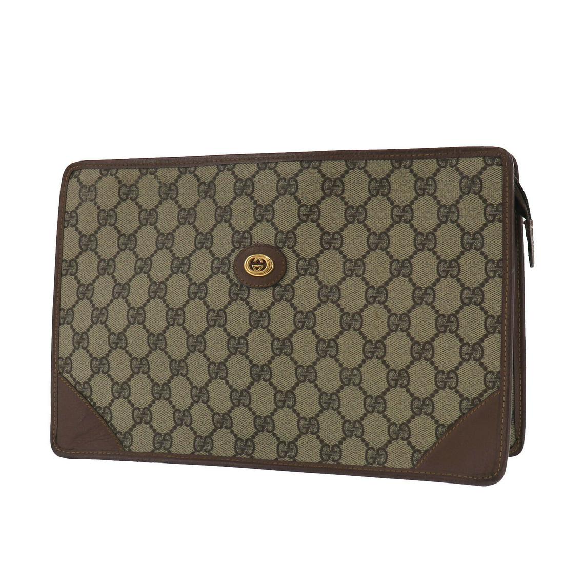 Authentic GUCCI VINTAGE PVC Leather Clutch: Brand: GUCCI Material: PVC Leather Style: Clutch Color: Brown Size(Inch): H 8.0 x D 3.1 x L 12.5 Country of Origin: Italy Come with: - All Bidhaus items come with a 100% money-back authenticity guaran