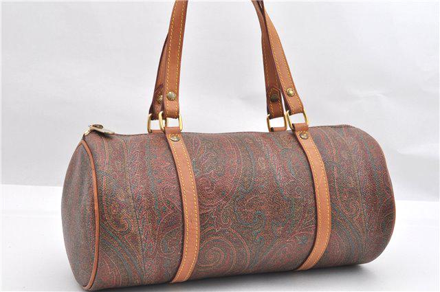 Authentic ETRO PVC Hand Bag: Brand: ETRO Material: PVC Style: Hand Bag Color: Brown Size(inch): W11.8 x H5.5 x D5.5" / Handle Drop 5.9"(Approx) Country of Origin: Italy Accessory: There is no ItemBox and DustBag.We will send only