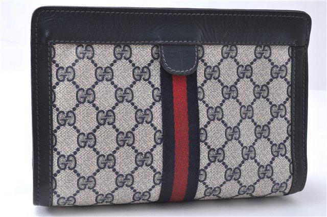 Authentic GUCCI PVC Clutch Bag: Brand: GUCCI Material: PVC Style: Clutch Bag Color: Navy Size(inch): W8.9 x H5.9 x D2.6"(Approx) Country of Origin: Italy Accessory: There is no ItemBox and DustBag.We will send only in photo. All Bid