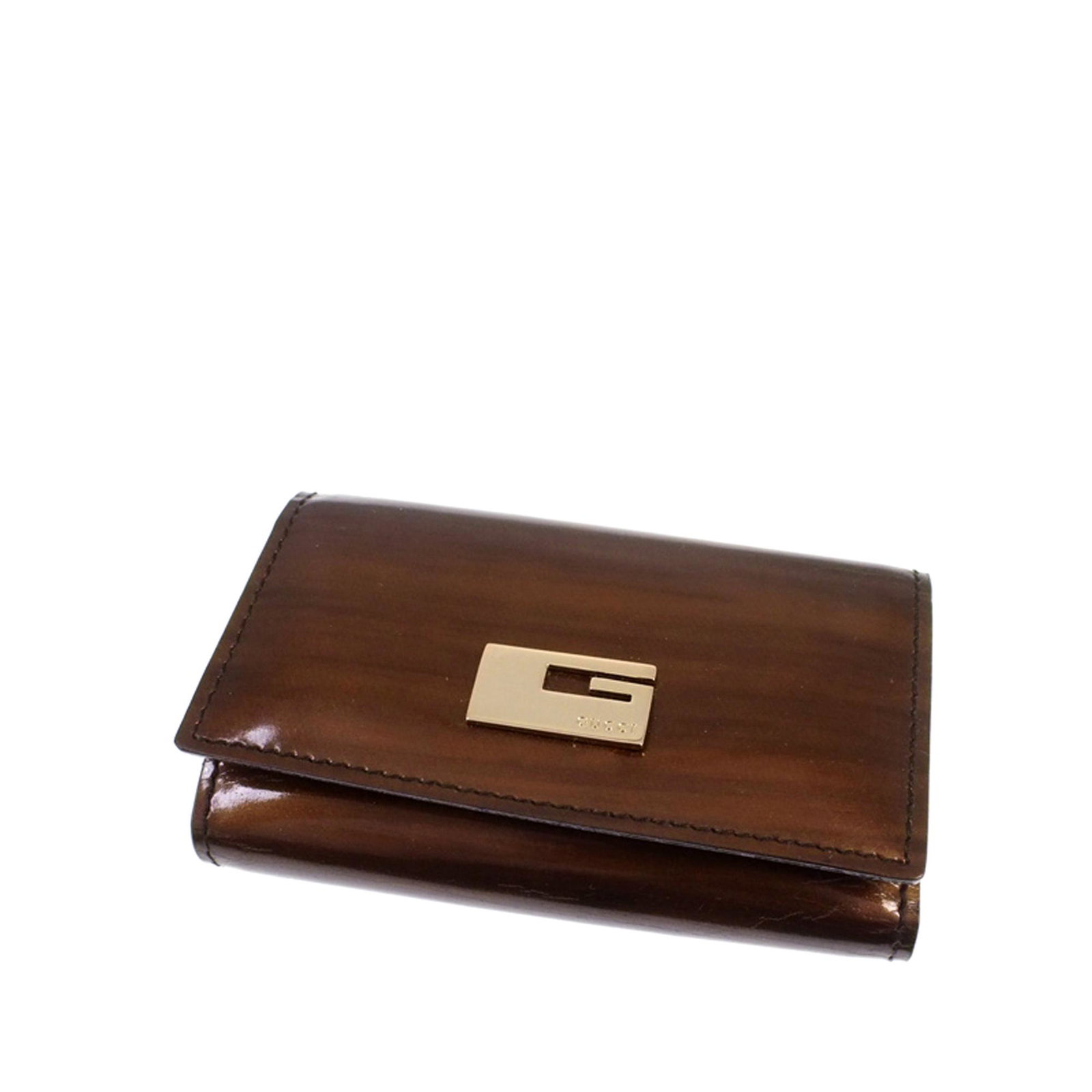 Authentic Gucci Patent Leather Key Holder: This key holder features a patent leather body and a snap button closure. Brand: Gucci Model: Patent Leather Key Holder Origin: Italy Category: Key Holder Color: Brown Style: Others Material: Leather 