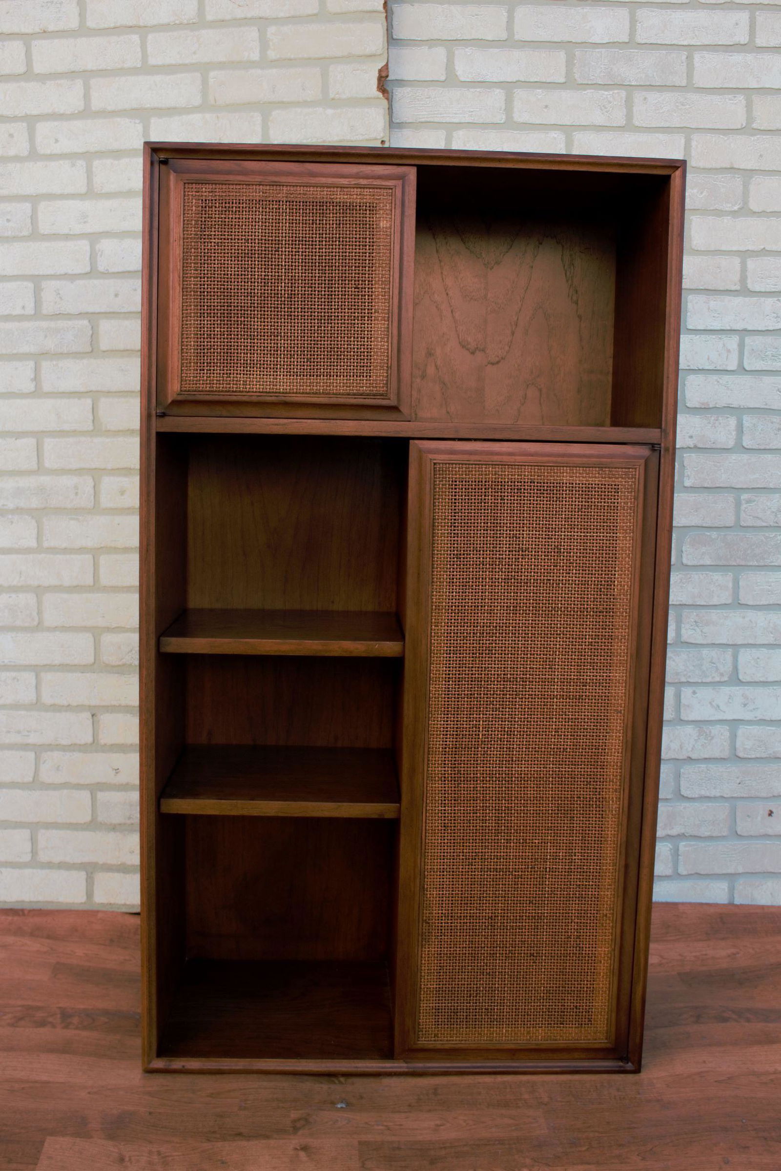 Mid Century Modern Jack Cartwright for Founders Wall: Mid Century Modern Jack Cartwright for Founders Wall Shelf Unit Cabinet Versatile mid century wall cabinet designed by Jack Cartwright for Founders. Medium brown wood grain finish with caned doors and