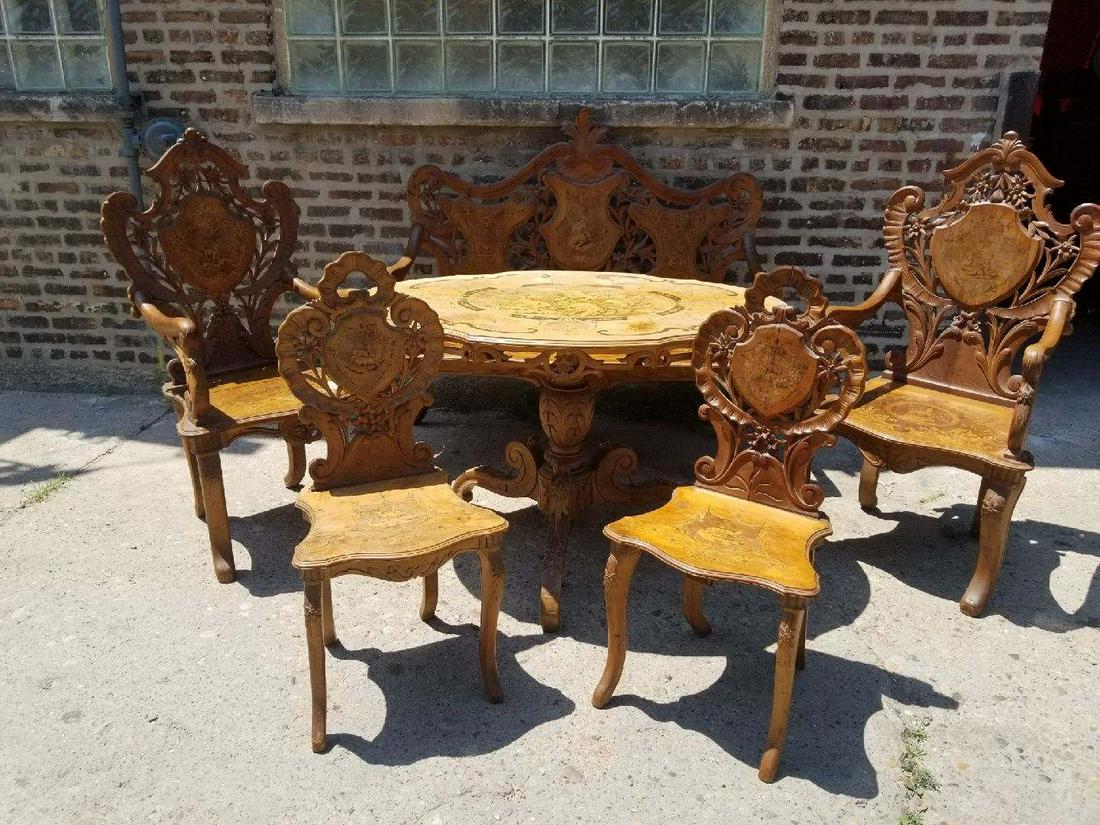 Antique Swiss Black Forest Hand Carved 6 Piece Parlor: Antique Swiss Black Forest Hand Carved 6 Piece Parlor Set Inclused 1) Marquetry Table 2) 2 Armchairs 3) 2 Side Chairs 4) Bench Circa Early 1800â€™s Ornate hand carved inlaid Swiss Black Forest Pa
