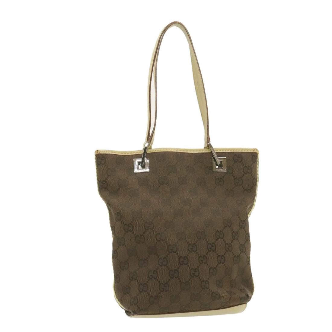 Authentic GUCCI GG Canvas Tote Bag Brown: Brand: GUCCI Style: Tote Bag Material: Canvas Color: Brown Made In: Italy Size (Inches): W9.84 x H9.44 x D3.93inch(Approx) Exterior Condition: Canvas : lose shape rubbing stain tear Lea